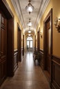 Interior of a classic hotel corridor with wooden doors and windows. Colonial, country style Royalty Free Stock Photo