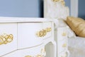 Interior in classic style. Luxurious white furniture with golden handles Royalty Free Stock Photo