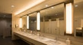 Modern Public Restroom with Multiple Sinks and Large Mirrors bathroom interior Royalty Free Stock Photo