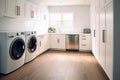 Interior clean white laundry room with front load washer and dryer units. Royalty Free Stock Photo