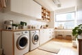 Interior clean white laundry room with front load washer and dryer units. Royalty Free Stock Photo