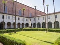 The interior of the Cloister of the Church of San Francesco with the statue of the Saint, in Lucca, Italy Royalty Free Stock Photo