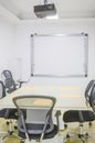 interior co working space rows with concrete white walls,black chair,wood brown and white table and conference room front view