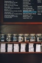 Interior of coffee shop. Wooden board with names of coffee hot and cold drinks, prices.