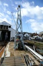 The interior of a boat repair yard, England. Boats under repair and slipways.