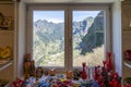 interior of the commercial establishment selling souvenir objects with a window overlooking the mountain