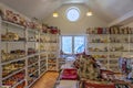 interior of the commercial establishment selling souvenir objects with a window overlooking the mountain