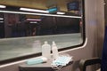 Interior commuter train in Switzerland with face mask and disinfectants as measure for fighting against coronavirus