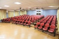 Interior of conference hall with red chairs Royalty Free Stock Photo