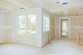 Interior construction of housing project with drywall installed and patched without painting applied Royalty Free Stock Photo