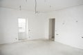Interior construction of housing project with drywall installed and patched without painting applied, plastered walls and Royalty Free Stock Photo