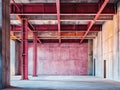 The interior of a construction site that is empty, with framed walls and pipes that have been exposed Royalty Free Stock Photo