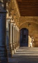 Interior of the corridor of the cloister of the University of Salamanca with the projected columns and arches illuminated by the