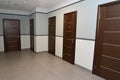 Interior of a corridor of office building with doors Royalty Free Stock Photo
