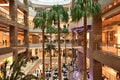 Interior of the Costanera Center mall with a view of palm trees and shops. Santiago, Chile