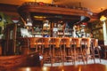 Interior of costly stylish bar, made of mahogany in the Irish pub. Royalty Free Stock Photo