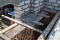 interior of a country house under construction. Site on which the walls are built of gas concrete blocks with wooden formwork Royalty Free Stock Photo