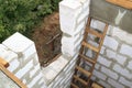 interior of a country house under construction. Site on which the walls are built of gas concrete blocks with wooden formwork Royalty Free Stock Photo