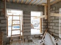 interior of a country house under construction. Site on which the walls are built of gas concrete blocks with wooden formwork Royalty Free Stock Photo