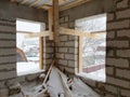 interior of a country house under construction. Site on which the walls are built of gas concrete blocks with wooden formwork Royalty Free Stock Photo