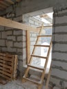 interior of a country house under construction. Site on which the walls are built of gas concrete blocks with wooden formwork Royalty Free Stock Photo
