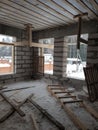 interior of a country house under construction. Site on which the walls are built of gas concrete blocks with wooden formwork Royalty Free Stock Photo