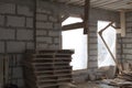 interior of a country house under construction with trim plywood. Site on which the walls are built of gas concrete blocks with Royalty Free Stock Photo