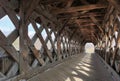 Interior of covered bridge with opening at the end. Royalty Free Stock Photo