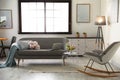 Interior of living room with grey sofa and rocking chair Royalty Free Stock Photo