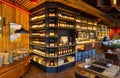 Interior of cozy luxury restaurant with original design and bottles of wine on the shelves