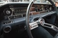 Interior dashboard of a classic Cadillac car, featuring horizontal analog gauges, mechanical controls Royalty Free Stock Photo