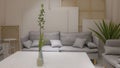Interior decoration, with soft sofa and white table. Branches in the vase on the table. Cozy place for rest Royalty Free Stock Photo