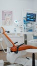 Interior of dentist stomatology orthodontic office with teeth radiography on monitor.