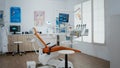 Interior of dentist stomatology orthodontic office with teeth radiography on monitor.