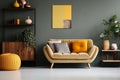 interior design, Abstract painting on grey wall of retro living room interior with beige sofa with pillows, vintage dark green Royalty Free Stock Photo