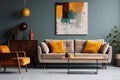 interior design, Abstract painting on grey wall of retro living room interior with beige sofa with pillows, vintage dark green Royalty Free Stock Photo