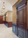 Interior design of a classic hall corridor with yellow wallpaper, brown doors and wood paneling. Backlit paintings and sconces on