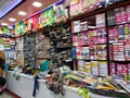 Interior Design Cloth Store and Colorful Men shirt, pant, saree and blouse rolled and well arranged in a shelf