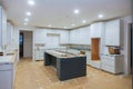 Interior design construction of a kitchen with cabinet maker installing custom Royalty Free Stock Photo