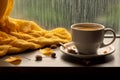 interior design, Cup of autumn tea (coffee, chocolate) and yellow dry leaves near a window, copy space. Royalty Free Stock Photo