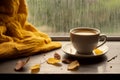 interior design, Cup of autumn tea (coffee, chocolate) and yellow dry leaves near a window, copy space. Royalty Free Stock Photo