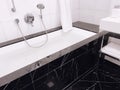 Interior design and decoration materials, luxury black marble tiled bathroom in five stars hotel room Royalty Free Stock Photo