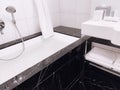 Interior design and decoration materials, luxury black marble tiled bathroom in five stars hotel room Royalty Free Stock Photo