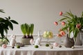 Interior design of easter dining room with colorful easter eggs, white hare sculptures, vase with tulips, plants, lamp, beige wall Royalty Free Stock Photo