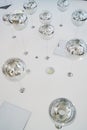 The interior design element of a huge store is the original form of transparent round glass ball-lamps of silver color