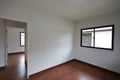 Interior design empty room with white wall and wooden laminate floor in new house Royalty Free Stock Photo