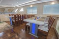 Interior of large salon dining area of luxury motor yacht Royalty Free Stock Photo