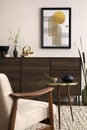 Interior design of harmonized living room with brown commode, design boucle armchair, coffee table, decoration, mock up poster Royalty Free Stock Photo