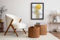 Cozy and stylish living room with mock up poster, white pouf, lamp, consola and personal accessories. Beige wall with carpet. Home