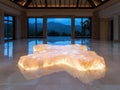 Interior design with illuminated rock formation and mountain view. Royalty Free Stock Photo